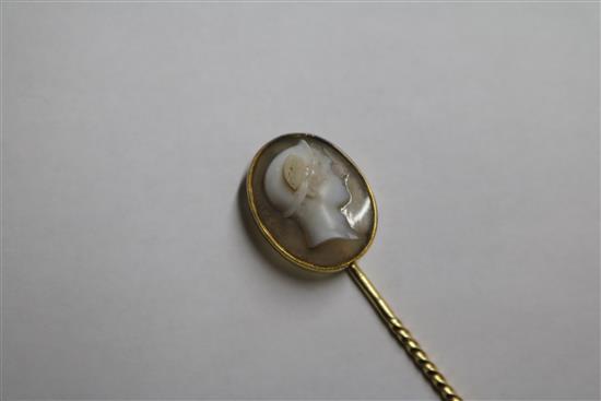 A 19th century yellow metal and sardonyx oval cameo stick pin, carved with the bust of Hermes to sinister, signed in Greek,